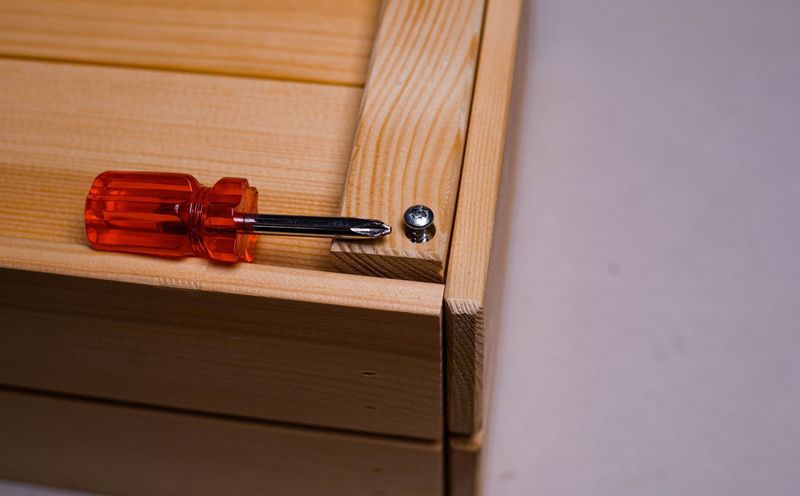 Handyman assembling a wardrobe in a Reading bedroom
