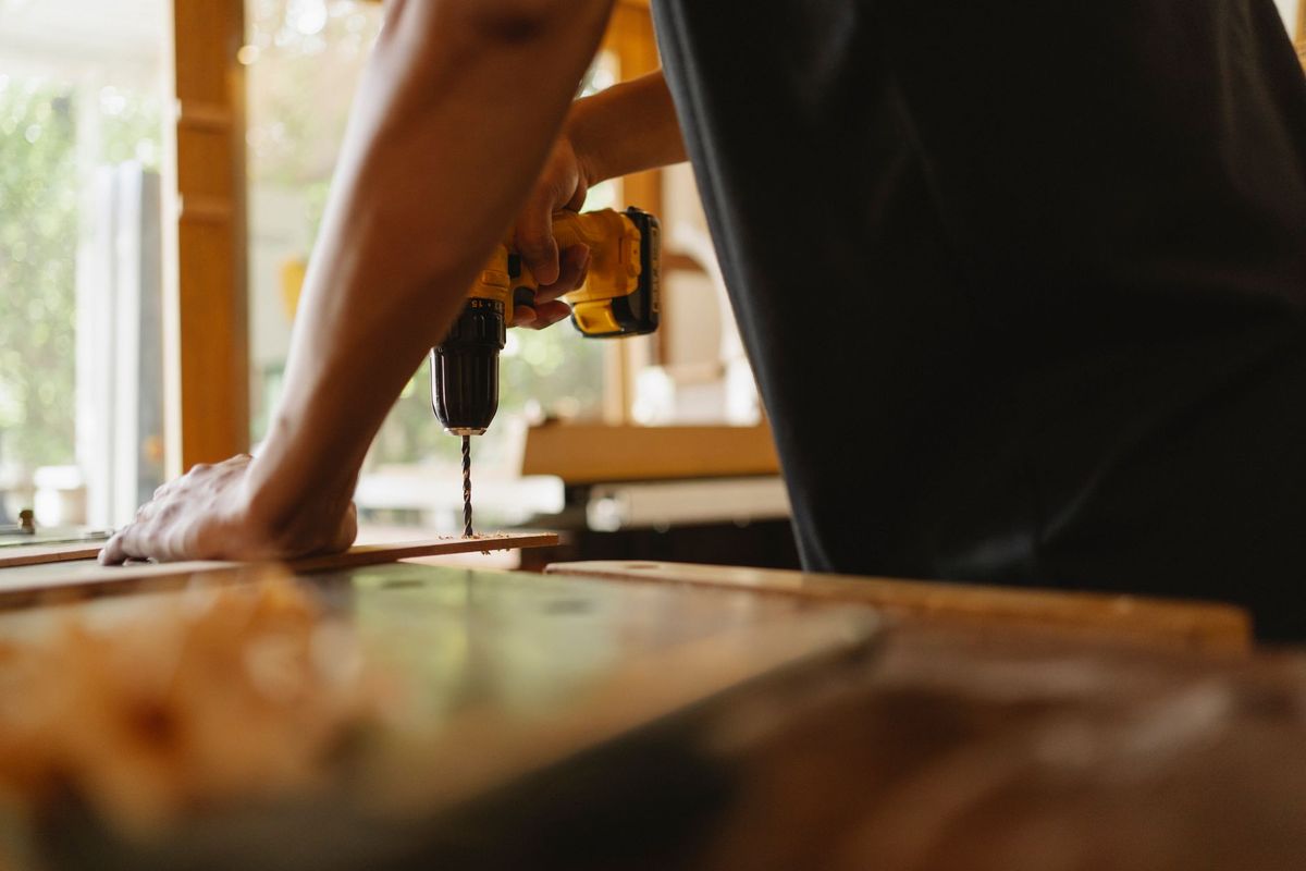 Handyman assembling flat-pack furniture in a Reading home