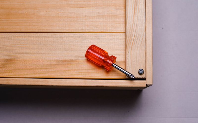 Handyman carefully working on an electrical wall socket
