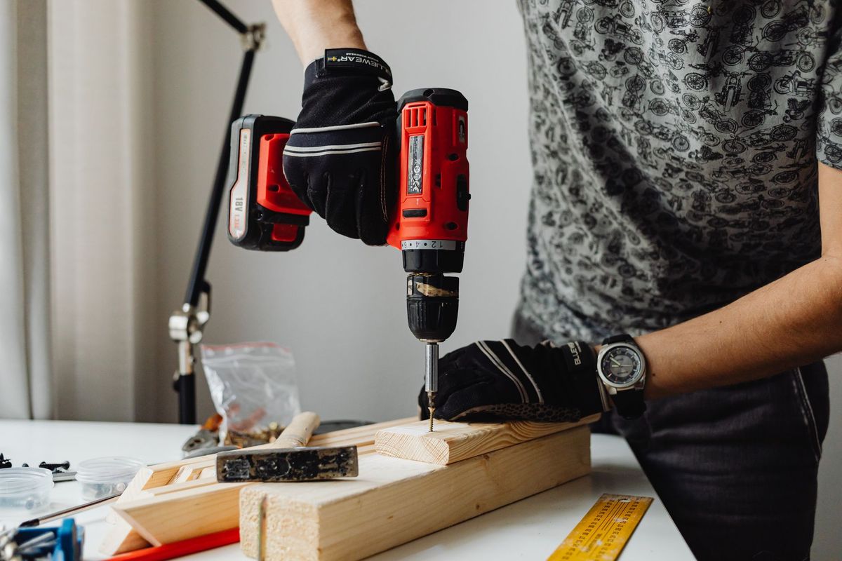 Handyman carefully repairing a household door in a Reading home