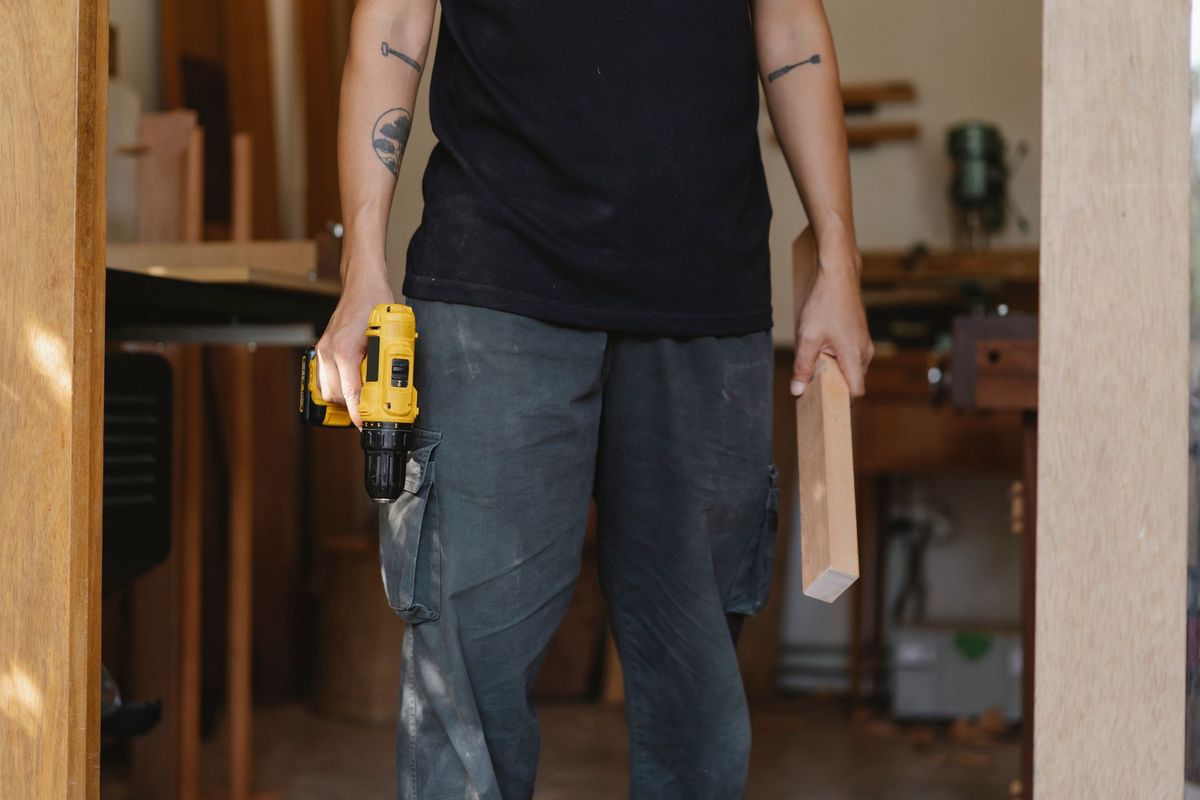 Handyman carrying out a careful home repair in a Calcot home